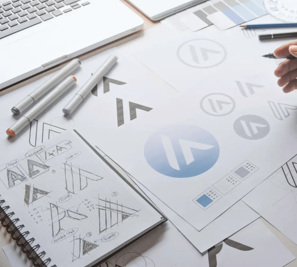 Logo development process showing concept sketches alongside a completed custom brand identity.